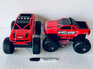 lot 164 image: Lot Of 2 - New With Tags Maxx Action 10 Mega Trucks - As Shown