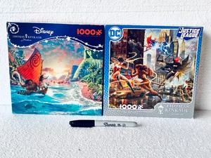 lot 185 image: Lot Of 2 New - Ceaco (1) Disney Moana & (1) DC Justice League Puzzle Sets, 1,000Pc Each Box - As Shown