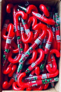 lot 333 image: Lot Of 134 - New Bee Christmas Candy Cane Tube with Chocolate Lentils, Artificially Flavored Candy - As Shown