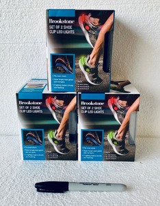 lot 399 image: Lot Of 3 - New Brookstone Set Of 2 Shoe Clip LED Lights, Securely Hooks Onto Your Shoes, GreenRed Each Box - As Shown - Total Retail $39