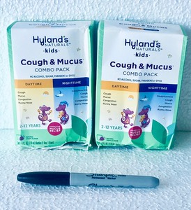 lot 445 image: Lot Of 2 - New Hylands Naturals Kids Cough & Mucus Combo Pack Grape, 8 Fl Oz Each Box - As Shown - Total Retail $26