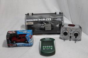 lot 67 image: Remote Controlled Helicopter, Metal Car and Handheld Game