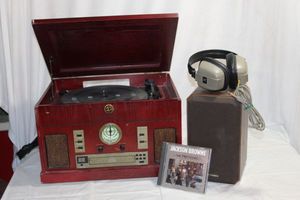 lot 115 image: Electro Brand Retro Record Player with Radio, CD, and Cassette (Powers On, Good Needle) also Speaker and Cassette included