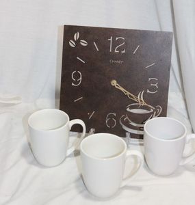 lot 220 image: Coffee Themed Clock and 3 White Coffee Cups