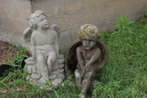 lot 43 image: Cherub Garden Statute, Little Lost Angel Statute on the right