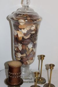lot 79 image: Large Glasses canister with popuri and brass candle holders and pillar candle