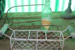 lot 185 image: Vintage Metal Bottle Holders and Vintage Bottle as shown