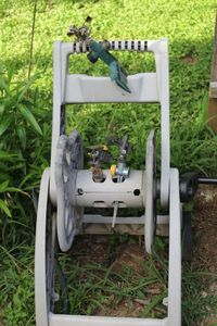 lot 220 image: Garden Hose Holder and Lawn Sprinlers
