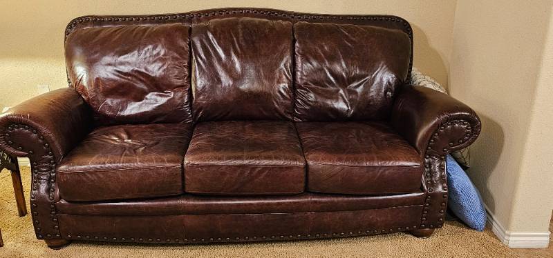 lot 1 image: Brown Leather Sofa