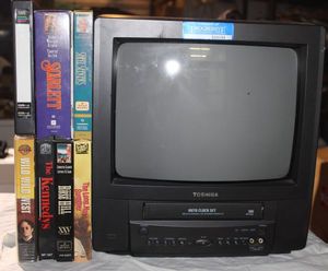 lot 76 image: Television with built in VCR and movies