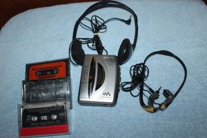 lot 35 image: Vintage Walkman Cassette Player, Headphones and cassettes