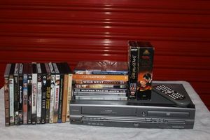 lot 36 image: Magnavox VHS and DVD Player with Movies as Shown