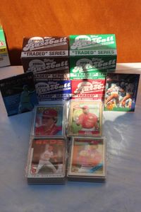 lot 29 image: Topps 1988, 89, 90, and 91 Traded Series complete Sets, 3 sets of Reds and 1 Cardinals Team Sets, and 2 unopen packages of Baseball Cards