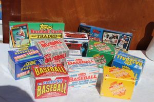 lot 20 image: Several Factory Sealed Boxes of Baseball Cards Topps 1990, 1992, and1994 Traded Series, Score Rookie and Traded 1990, 1991, and 1992, Fleer Updated 1989, 91, 88