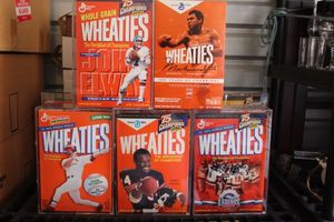 lot 153 image: Collectable Unopened Wheaties Cereal Boxes with 4 Hard Display Covers