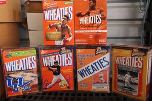 lot 154 image: Collectable Unopened Wheaties Cereal Boxes with 4 Hard Display Covers