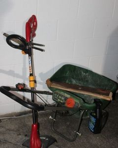 lot 254 image: Seed Spreader, Electric Weed eater, Lawn Mower Blade, and more
