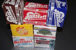 lot 320 image: Factory Sealed Topps Traded 1992 and 93, Score Rookie and Traded 1990, and Fleer Updated 1988  Also Complete Topps Traded 1986, 1988, and 1990