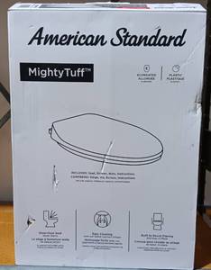 lot 43 image: AMERICAN STANDARD MIGHTY TUFF ELONGATED TOILET SEAT #1694170 IN BOX AS SHOWN.
