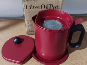 lot 99 image: UNIKON FILTER OIL POT (RED) IN BOX AS SHOWN.