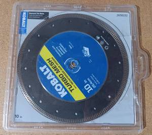 lot 114 image: KOBALT TURBO MESH 10 DIAMOND TILE BLADE WET SAW DISCS IN PACKAGE AS SHOWN.