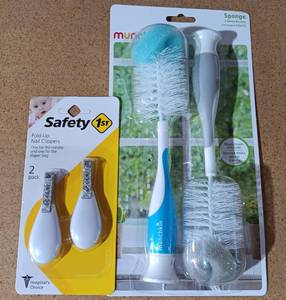 lot 131 image: NEW, UNOPENED MUNCHKIN BOTTLE BRUSHES AND SAFETY 1ST NAIL CIPPERS AS SHOWN.
