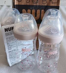 lot 289 image: LOT OF 4 NUK BABY BOTTLES AS SHOWN.