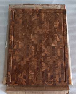 lot 310 image: ZIRUMA XXL END GRAIN BUTCHER BLOCK CUTTING BOARD WITH JUICE GROOVE MADE OF TEAK WOOD AND CONDITIONED WITH BEESWAX, LINSEED OIL, AND LEMON OIL. 24 X 18 X 2 AS SHOWN. REVERSIBLE CHARCUTERIE BUTHER BLOCK. RETAILS FOR $129.95