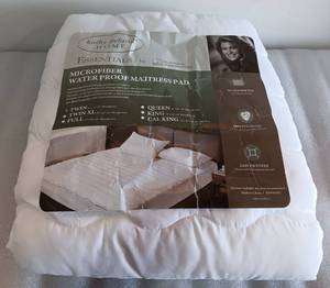 lot 334 image: KATHY IRELAND HOME TWIN SIZE, MICROFIBER WATERPROOF MATTRESS PAD, WHITE AS SHOWN.