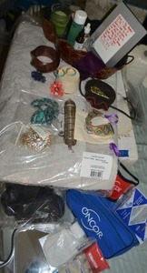lot 93 image: Jewelry, First Aid Kit, Diabetic Testing kit, Grey Bath rug unopened in packaging