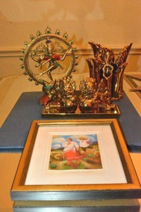 lot 109 image: Coral and Turquoise Brass Dancing Shiva, Carter Holmans The Sun Rise print, Golden Lion Salt and Pepper shakers, Z Gallerie Gold Marlin Vase