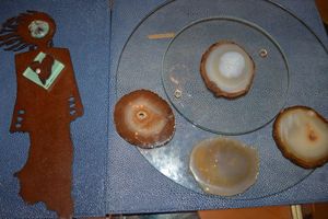 lot 110 image: Natural stone slices, Native American woman metal and stone art piece, clear glass lazy Susan