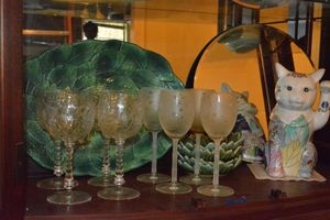 lot 118 image: Artisan Sun and Moon Etched wine glasses, Vintage Crystal wine goblets, Chinese Reproduction Cat Statue, Williams Sonoma Leaf Tray, and sauce dipping bowls