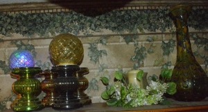 lot 135 image: Light-up Mercury glass candle holders and light-up globes, Green glass vase, Candle table centerpiece.