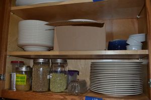 lot 128 image: Vivo White China bowls and plates and crme Brule baking bowls from Williams Sonoma. Cobalt Blue, Green tea Matcha Set. Assorted Spices in glass canning jars and ramekins.