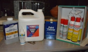 lot 131 image: Butane Fuel cans, Paint thinner, 1 Gal. Isopropyl Alcohol, Mineral Spirits