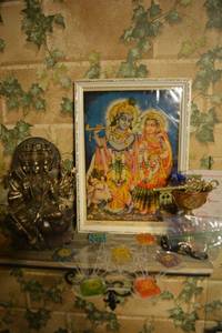 lot 144 image: Vintage Hindu Print from popular Hindi artist no longer living. Copper goblet, brass key, Sacred Geometry tray with Chakra stones, Hindu deity statue and Black Arch angel sacred geometry stones (Michael, Gabriel, Uriel)