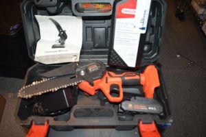 lot 159 image: Aishikeke Cordless Chainsaw with lithium battery and bar  chain oil