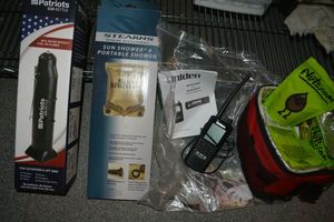lot 239 image: Nuts.Com powders, Uniden Scanner, Sun Shower, Patriots Sun Kettle
