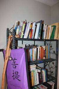 lot 299 image: Alaskan bear walking stick, Buddha banner, Self-Care books