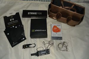 lot 95 image: STRIKEPEN, Identity Stronghold Wallet, USMC mini knife, Emergency Blanket, RFID Sheath Protectors with Gold Bag