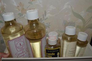 lot 41 image: Lamp and candle oil smokeless and odorless, plus candle wax remover.