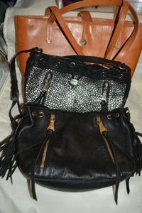 lot 56 image: Aimee Kestenberg Black Leather purse and Aimee K. Silver Pebbled Drawstring Front purse plus brown leather Franklin Covey bag.