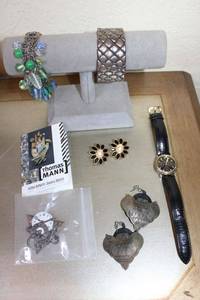 lot 373 image: Jewelry with bracelet display stand Jules Jurgensen watch with black leather band, Thomas Mann Steampunk Handmade Timepiece Brooch and more