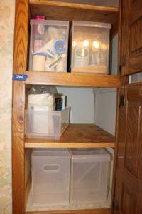 lot 364 image: Small plastic storage organizers with contents toothbrushes, muscle therapy bath, disposable gloves and more