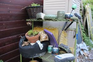 lot 402 image: Flower pots with glass bird garden stake