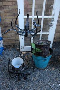 lot 424 image: Octopus metal plant stands, rubber and basket flower pots with Hamsa Hand wind chime