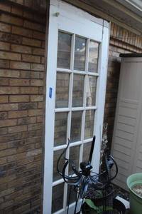 lot 423 image: Outdoor wood door with glass panels