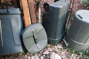 lot 439 image: (3) green plastic trash bins