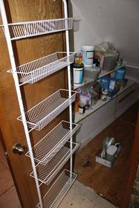 lot 473 image: Closet contents food and LocknLock storage containers, white wire over-the-door organizer